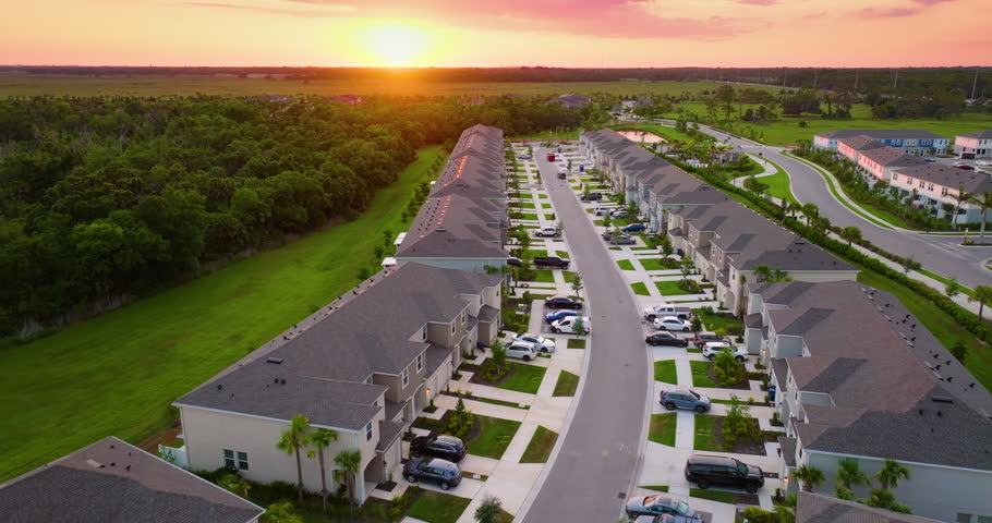 Apartment-style condominiums in Florida suburbs, surrounded by greenery and designed for modern suburban living in the USA.