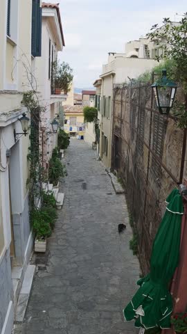 Panoramic aerial view of old pavement street in old town of Athens called Plaka, aerial drone vertical shot