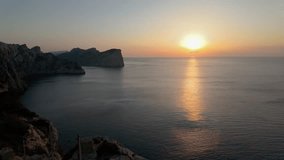 Golden sunset over the calm mediterranean sea from the famous cape formentor viewpoint in mallorca, balearic islands, spain - Powered by Shutterstock - Get 15% off with code: PIKWIZARD15
