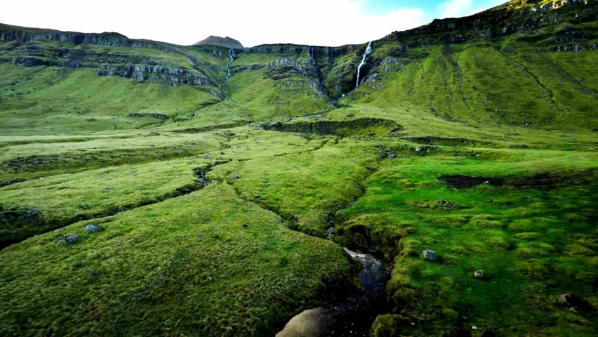 Icelandic Landscape: Lush Green Valley with Waterfall