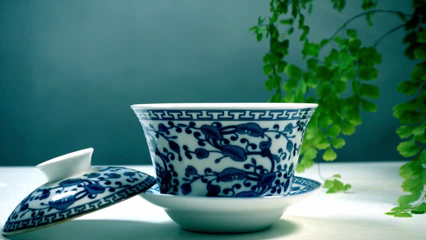 Gaiwan Tea Ceremony: Porcelain Teacup with Pouring Water - Powered by Shutterstock - Get 15% off with code: PIKWIZARD15