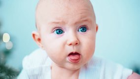A charming baby with striking blue eyes exhibits a look of surprise while exploring their cozy indoor environment. The baby, dressed in a soft outfit, is captivated by their surroundings, displaying - Powered by Shutterstock - Get 15% off with code: PIKWIZARD15