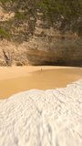 Cinematic FPV drone shot of woman running in yellow swimsuit along empty tropical beach in Bali, Indonesia. Perfect for lifestyle, freedom, travel, summer, wellness, and adventure themes. - Powered by Shutterstock - Get 15% off with code: PIKWIZARD15