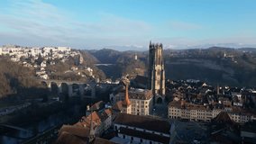 Fribourg, Switzerland: Aerial drone footage with a cinematic motion close to the gothic St Nicholas cathedral bell tower in Fribourg famous medieval old town in Switzerland.  - Powered by Shutterstock - Get 15% off with code: PIKWIZARD15