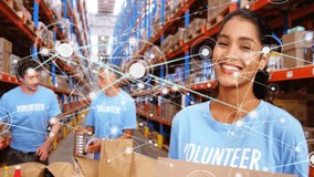 Two volunteers packing food for charity as woman holding donate sign initiating network overlay. Volunteering, charity, donation, teamwork, community, logistics, humanitarian - Powered by Shutterstock - Get 15% off with code: PIKWIZARD15
