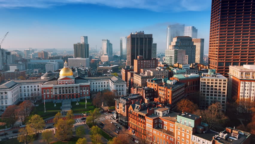 Beautiful architecture of modern Boston on sunny day. Approaching the building of Massachusetts State House. Aerial view.
