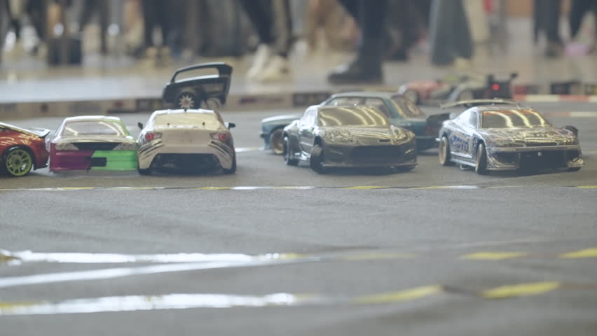 SLOVENIA, LJUBLJANA - 10. MAY 2025: Rc car toy model remote drifting cars parked at Auto Motor Show Ljubljana 4K