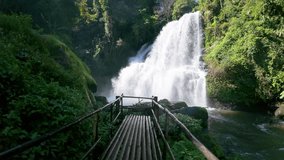 Bamboo bridge path through green jungle to Pha Dok Seaw Waterfall in Chiang Mai, Thailand.
 - Powered by Shutterstock - Get 15% off with code: PIKWIZARD15