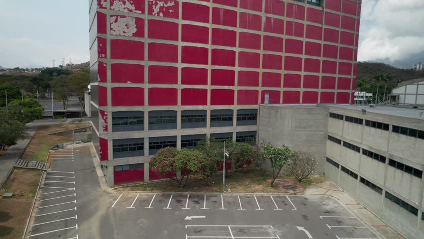 Modernist red building facade of Biblioteca Central UCV, iconic Caracas university library
