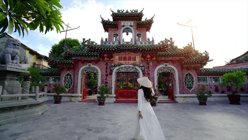 Tourist walking at Fukian Assembly Hall in the Hoi An ancient town, Vietnam.