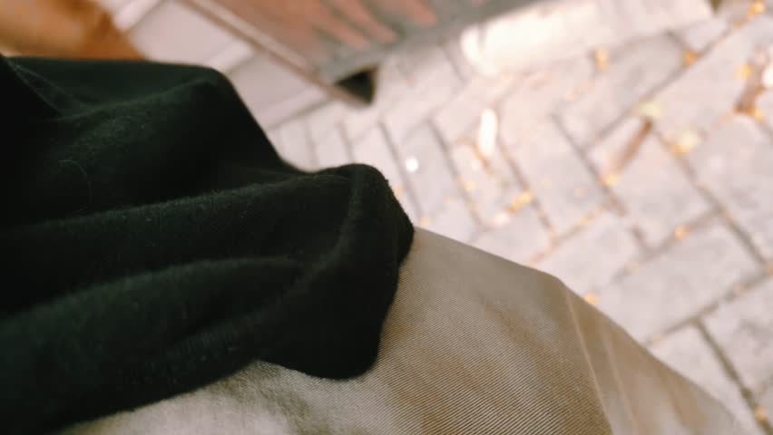 Close up POV shot of a person retrieving a wallet from their pocket, preparing to take out a credit card