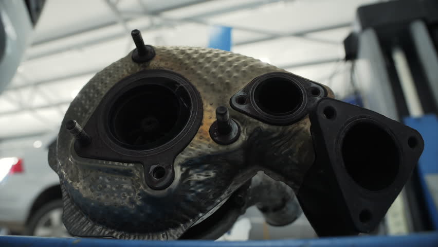 Used turbocharger part placed on workshop table