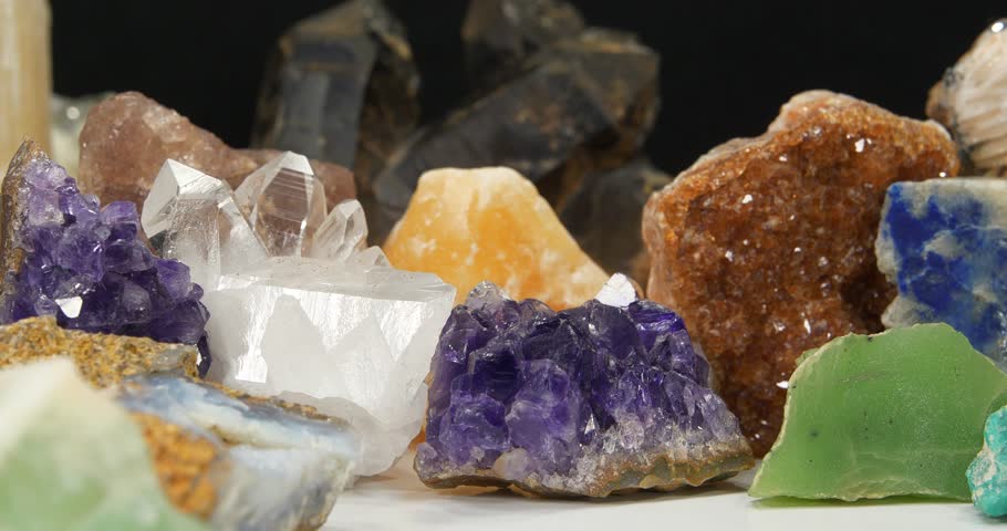 Natural Semi Precious stones and minerals, riches of Earth. Purple Amethysts, Gypsum, Quartz crystals, green Nephrite, Lazurite, yellow Calcite and Citrine, Amazon stone, Green garnet