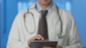 Medical professional scanning fingerprint on tablet, verifying identity and safeguarding sensitive patient information within advanced digital healthcare environment concept - Powered by Shutterstock - Get 15% off with code: PIKWIZARD15