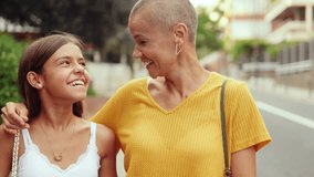 A young girl and her mother talk and smile outdoors. They look happy. This joyful moment reflects the warm bond between parent and child. - Powered by Shutterstock - Get 15% off with code: PIKWIZARD15