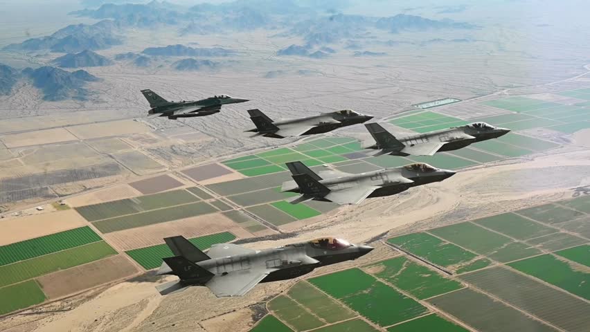 Close up view of F-35 and F-16 Fighter Jets in the sky