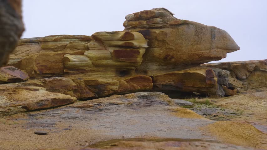 Footage showcases Two Brothers red rock formations along Barents Sea, Fishing Peninsula, northern Russia’s Arctic coastline.