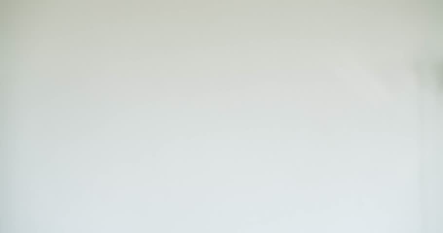 Excited man wearing a birthday hat and funny glasses dances and points at the camera. He is having a blast celebrating his birthday, enjoying the festive atmosphere and sharing his joyful spirit.