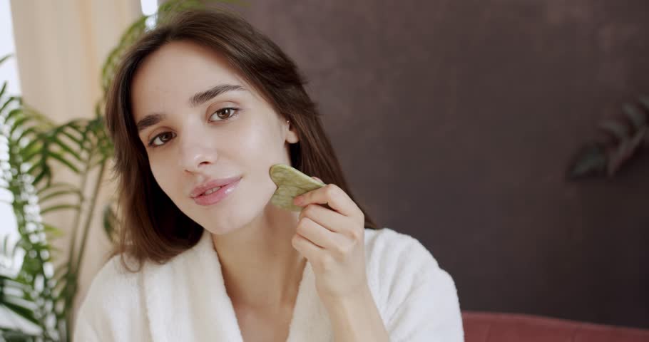 Concept of skincare cosmetology natural beauty cosmetics face building. The concept of home care. Facial treatment practice for rejuvenation. Facial skin care lifting and beauty rituals.