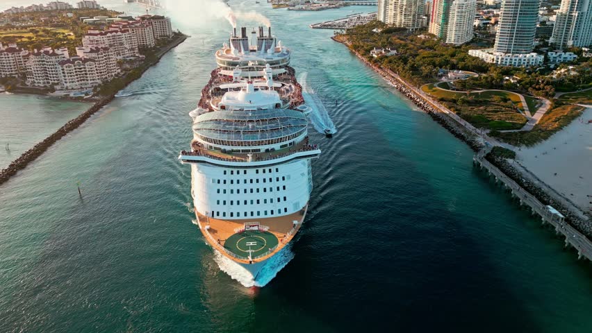 Cruise ship voyage. Aerial view of cruise in summer vacation. Cruise ship tour and travel at sea. Aerial view of luxury liner voyage. Ship leaving Miami beach port. Miami tour. Ocean cruise departure