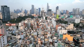 Aerial view of Ho Chi Minh City skyline with dense low-rise buildings contrasting with modern skyscrapers, Vietnam. Urban growth, contrast, and architecture themes. - Powered by Shutterstock - Get 15% off with code: PIKWIZARD15