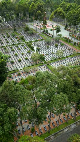 Aerial view of military cemetery in Cu Chi, Vietnam. Ideal for history, remembrance, and architecture themes.