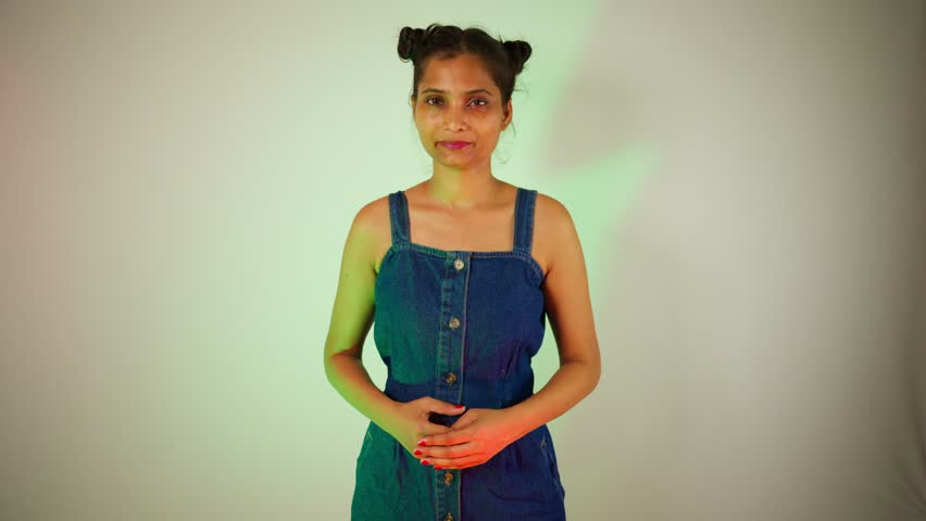 Trendy Female Portfolio Shoot in Style indoor, Confident lady models with bun hairstyle by camera, Fashionable Woman Strikes Poses Boldly, Elegant beauty displays her acting persona, Modish actress