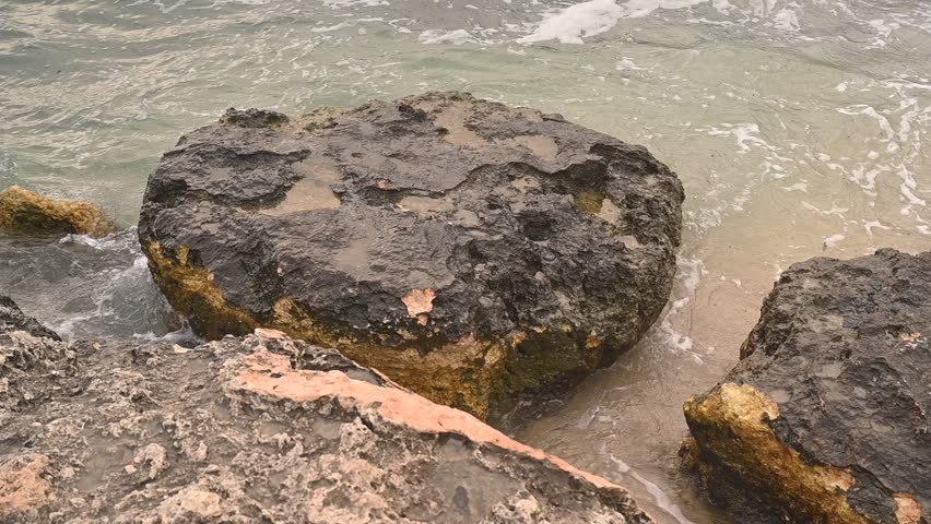 Ostuni di Mare, Italy, sea waves in the morning, Rocky coast of the Mediterranean Sea, two rocks