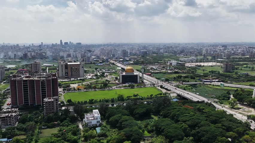  drone flyby showing the elegant architecture of a mosque in Bangladesh surrounded by a serene environment