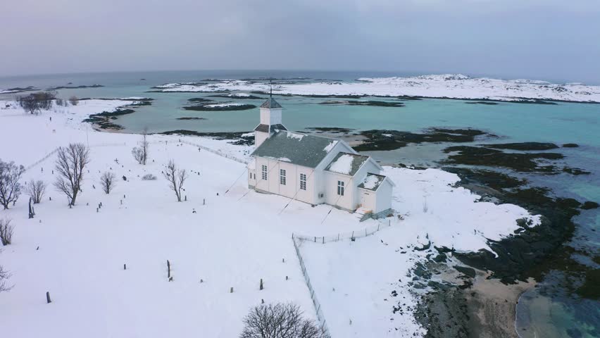 Gimsoy Church, Norway, Europe. Wonderful winter scene of Lofoten Islands. Picturesque morning seascape of Norwegian sea. Life over polar circle.