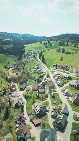 Small village in mountain valley in Black Forest, Germany. Nature landscape with village and mountain and hills on horizon. Vertical video