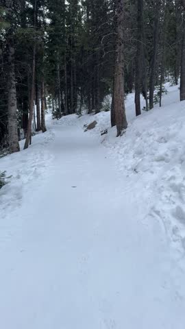 A winter hike through the snow covered mountains at Bear Lake in Rocky Mountain National Park
