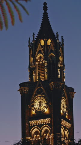 Rajabai Clock Tower In Evening Illumination. Clock Tower In Mumbai India. Confines Of Fort Campus Of University Of Mumbai. It Stands At Height Of 85 M or 280 Ft. Modeled It On Big Ben In London.