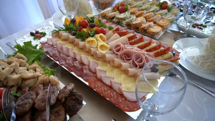Delicious appetizer spread with assorted meats cheese and vegetables on a table