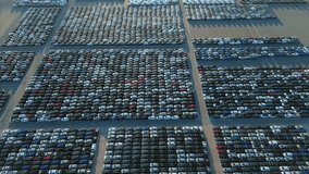 New Cars on Large Full Parking Lot in Port Ready for Distribution. Harbor Vehicle Storage for Export and Import. Automotive Industry. Aerial View. Moving Forward - Powered by Shutterstock - Get 15% off with code: PIKWIZARD15