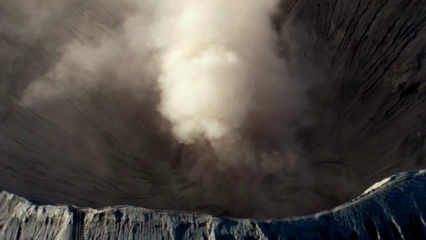 Aerial View of Volcanic Crater with Eruption Plume