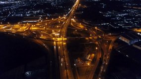 Aerial Night View of Illuminated Highway Interchange and Cityscape - Powered by Shutterstock - Get 15% off with code: PIKWIZARD15