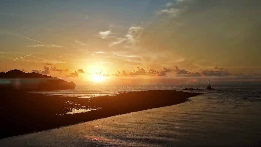 Serene Sunrise Over Coastal Landscape with Mist
