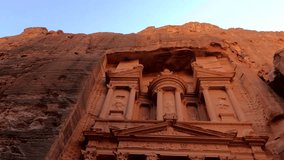 Low angle view of the ancient rock-carved Treasury facade, an iconic landmark in Petra, Jordan. - Powered by Shutterstock - Get 15% off with code: PIKWIZARD15
