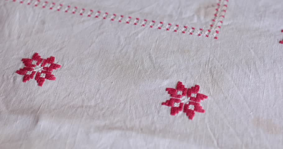 Cottagecore aesthetic comes alive with vintage tablecloth featuring intricate embroidery and folk motifs. Old fabrics with dirty spots. Tablecloth countryside style that enhances any rustic setting.