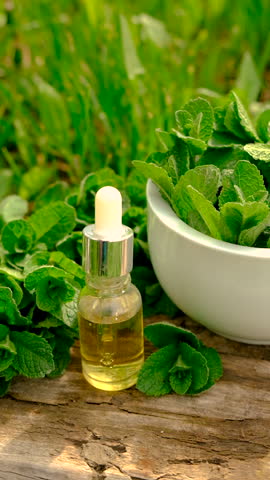 Peppermint extract essential oil and supplements. Selective focus.