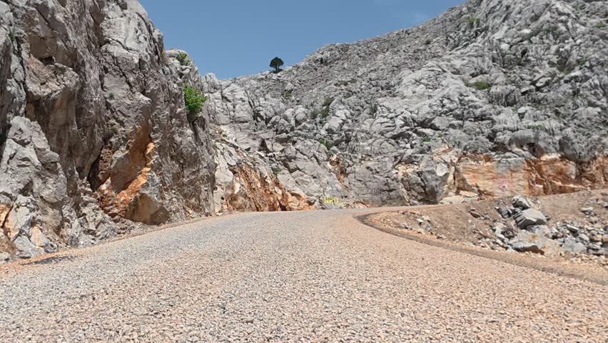 Winding mountain road. Sunny road . High quality FullHD footage