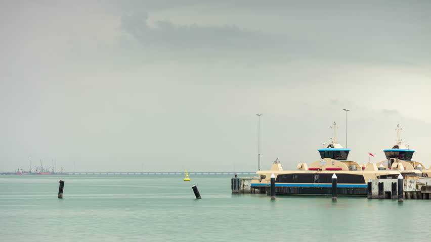 day time storm sky george town city water ferry station traffic bay panorama 4k timelapse penang malaysia