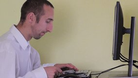 Businessman counting money while sitting at a computer, earning money on computer, work online, counting money - Powered by Shutterstock - Get 15% off with code: PIKWIZARD15
