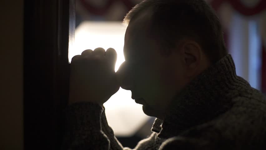 Sad man in apartment during crisis. Concept of depression, tragedy