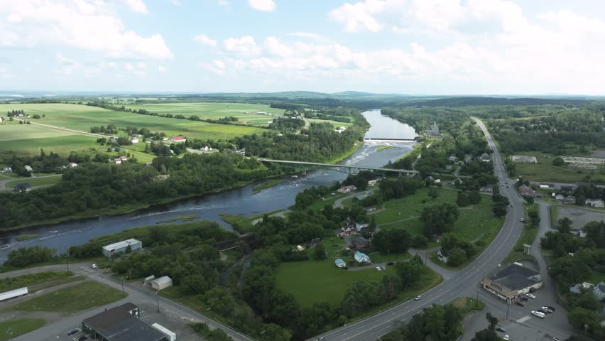Aerial view of Aroostook County, Maine with river, bridges, farmland, and countryside roads.