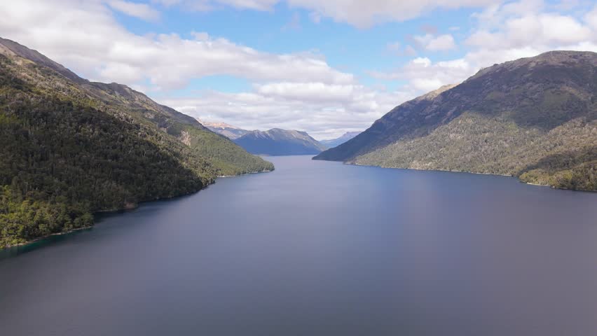 Tranquil mountain lake surrounded by forested hills in Pichi Traful, Argentina