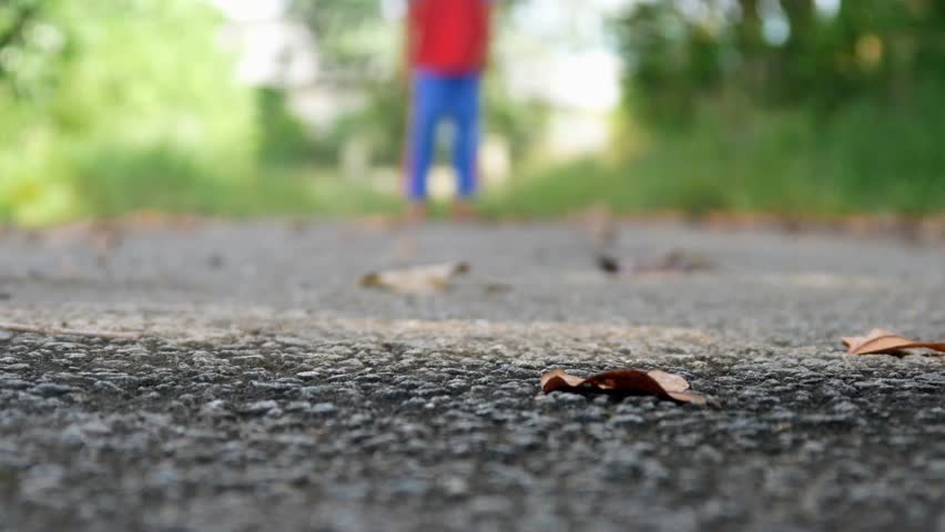Abandoned asphalt road and a boy