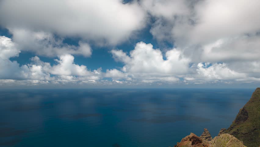 Clouds with shadows and reflections in the ocean timelapse video