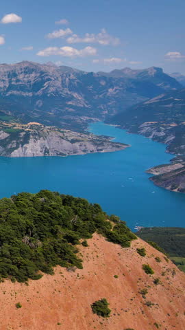 Summer aerial view of Serre-Poncon lake with Grand Morgon peak. Durance Valley. Hautes-Alpes (French Alps), France